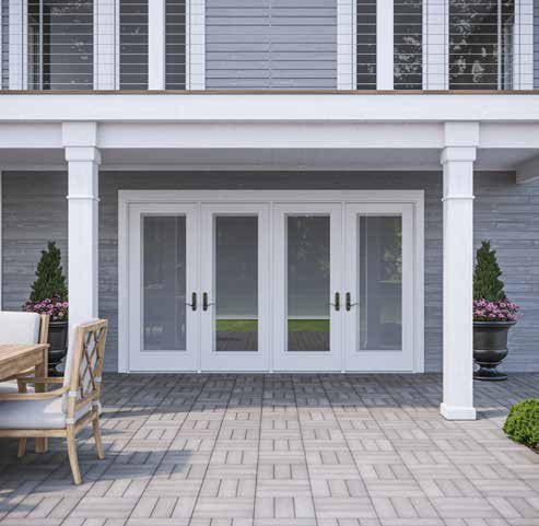 White double entry doors opening onto a patio