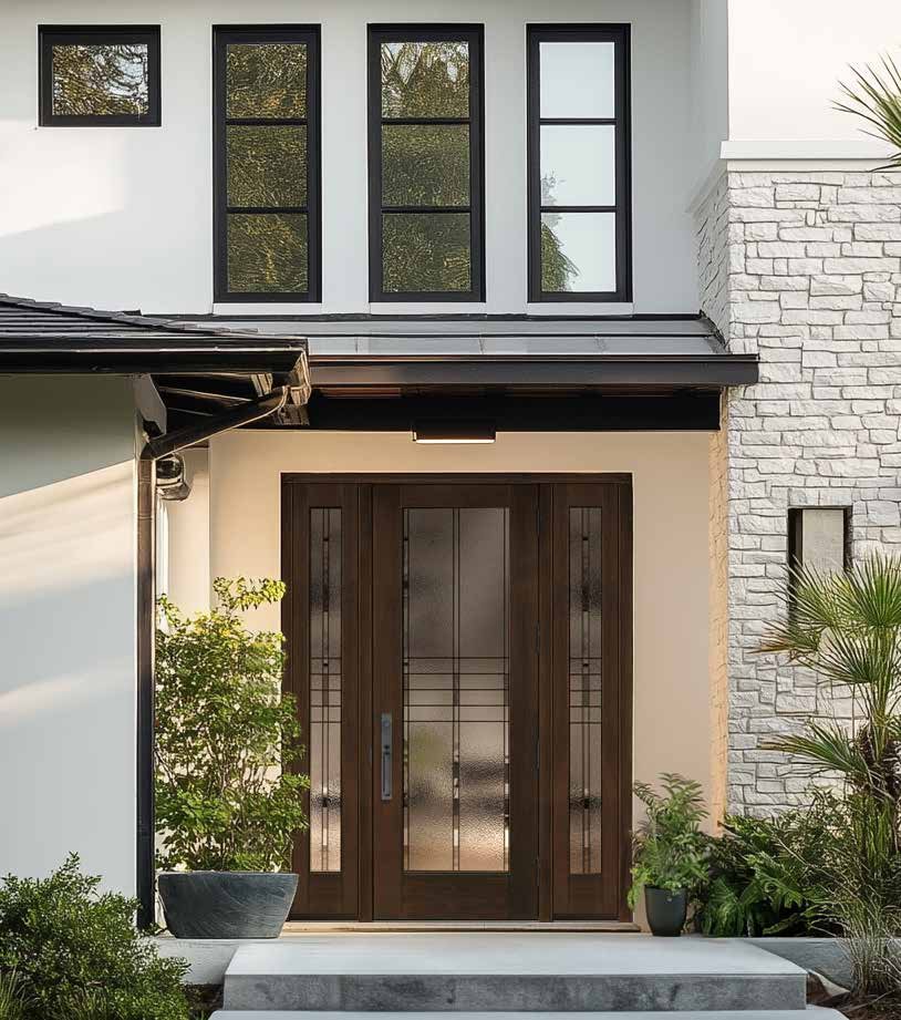 Wood entry door with sidelites on a new home