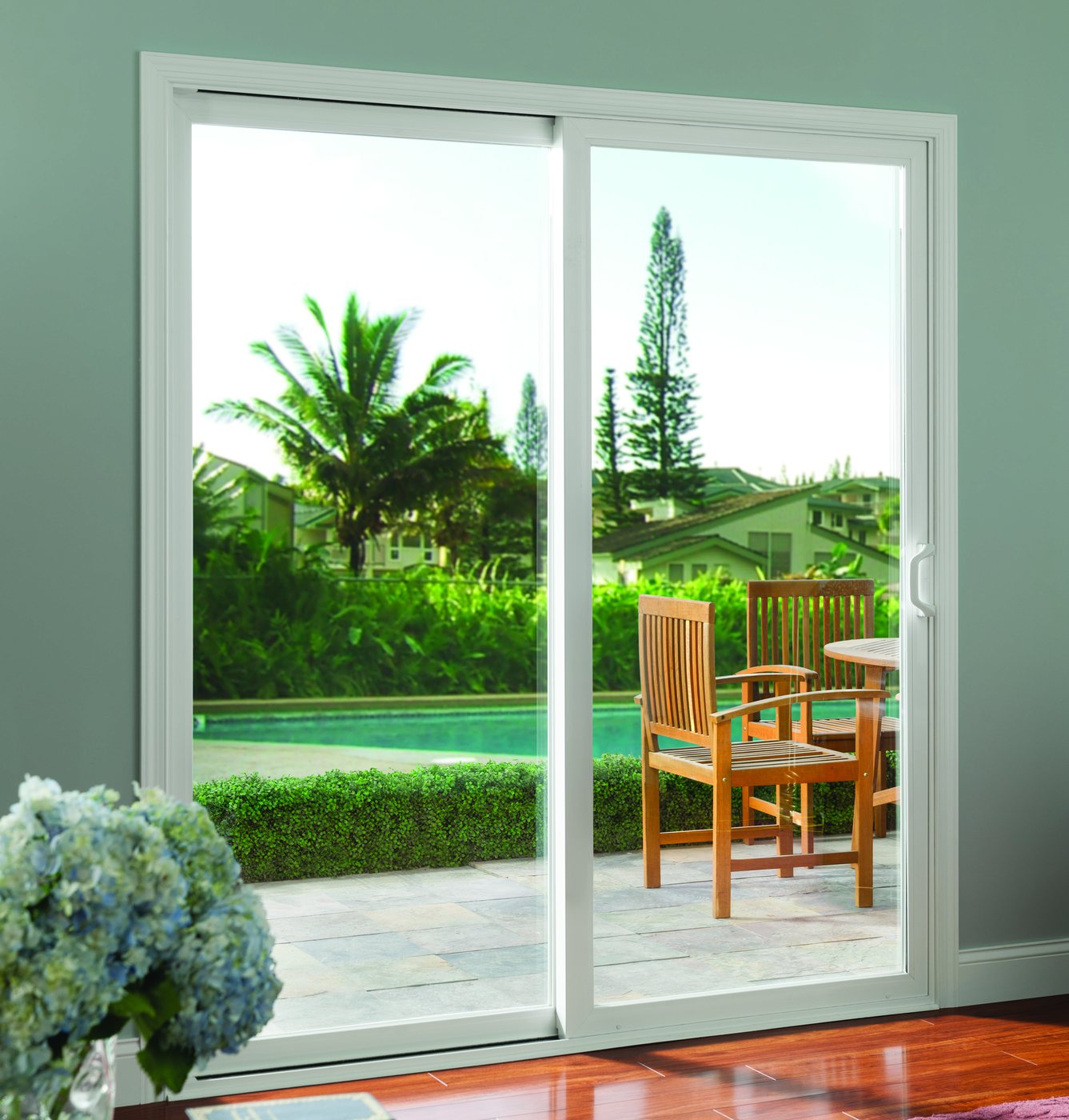 Sliding patio door opening to a pool deck
